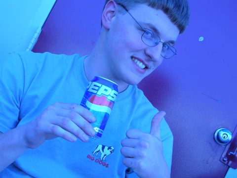 1996 Ford Probe - A young man smiles and gives a thumbs-up gesture while holding a can of Pepsi.