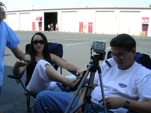 1996 Ford Probe - People are seated in chairs in an outdoor setting, with a camera on a tripod in the foreground.