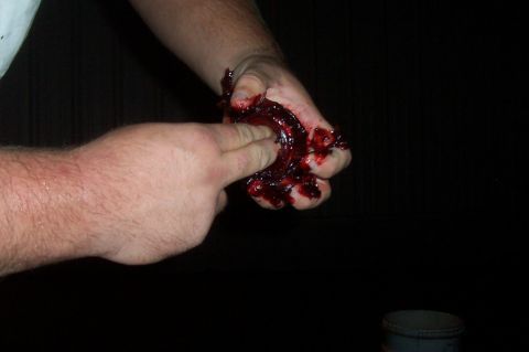 1994 Ford F-150 - A hand is shown holding a damaged bearing covered in blood.
