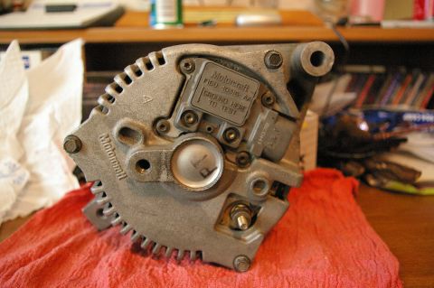 1986 Ford Bronco - Close-up of a Motorcraft alternator, part number F1DU-10346-AA.
