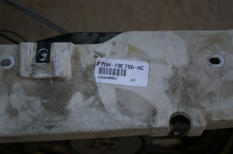 1986 Ford Bronco - A part with a label showing a part number and barcode is shown.
