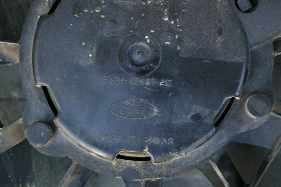 Black Ford electric fan with part number F62H-82627-AC visible