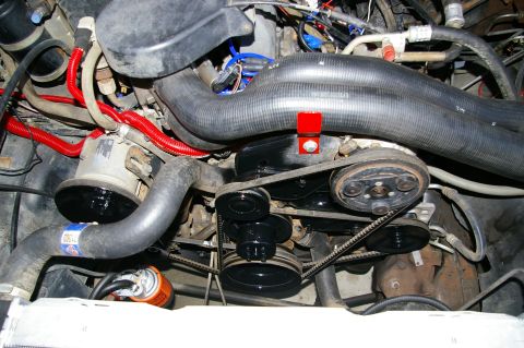 1986 Ford Bronco - Close-up view of a vehicle's engine compartment, showing various mechanical components and wiring.