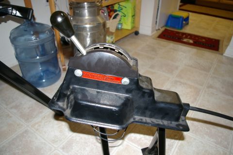 1986 Ford Bronco - A close-up view of a shifter assembly with an orange label that has some readable text.