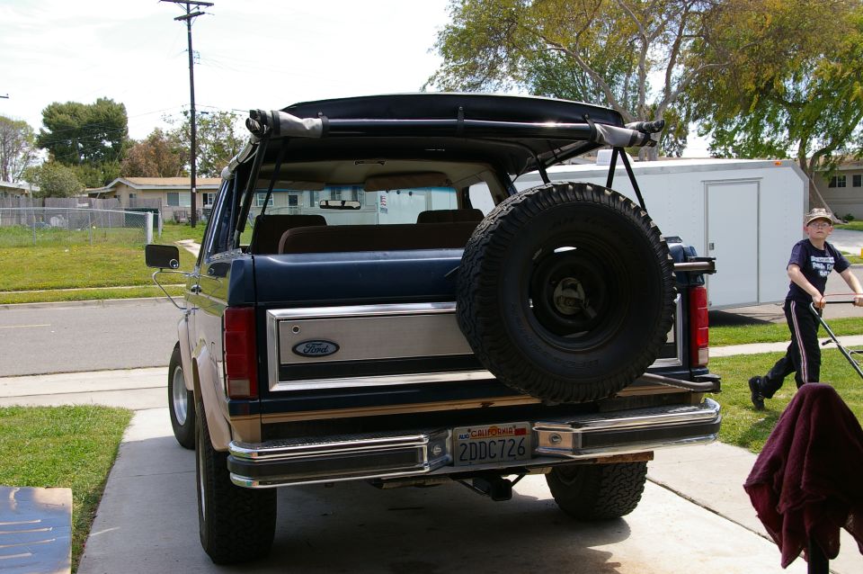 Ford Bronco with soft top removed, spare tire on rear, California license plate 2DDC726