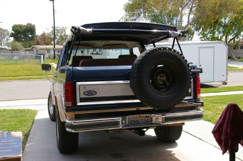 1986 Ford Bronco - This 1986 Ford Bronco features a removable soft top and a rear-mounted spare tire.