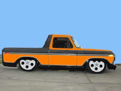 1979 Ford Bronco - This customized pickup truck features a two-tone paint scheme and unique wheels.