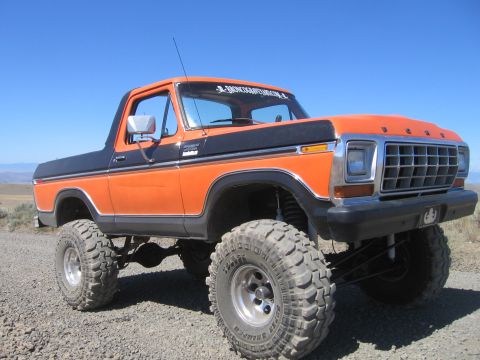 1979 Ford Bronco - This lifted Ford Bronco features a two-tone paint scheme and aggressive off-road tires.