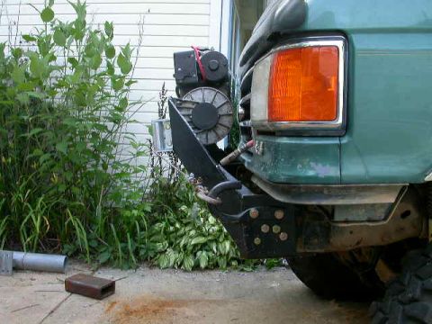 1990 Ford Bronco - Side view. Goes straight up from the frame rails, so a nice aproach angle is maintained.