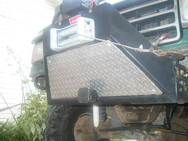 After the crossbar I thought it would be a good idea to add a towing receiver, and then a skid plate.