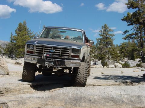 1986 Ford Bronco - This 1986 Ford Bronco navigates a rocky trail with its front end lifted high.