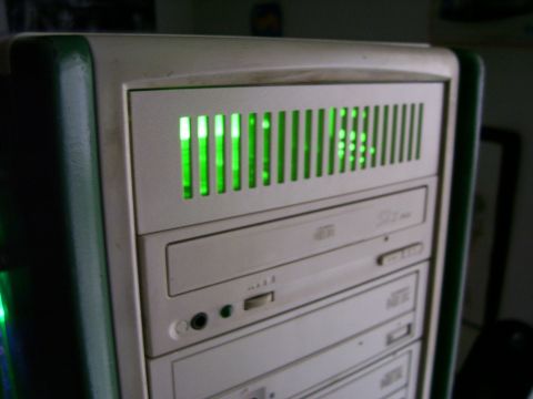 1994 Ford Probe - A computer tower is shown with green lights glowing behind a slatted front panel and several drive bays visible.