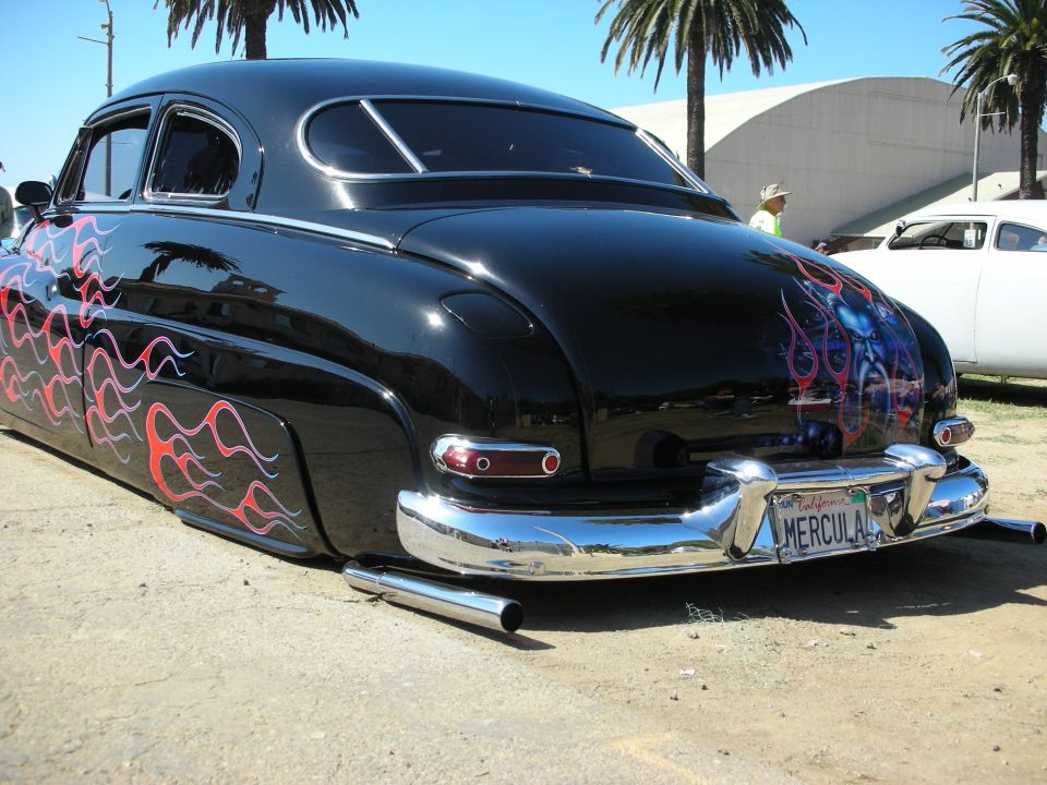 Rear of black flamed chopped Mercury custom with MERCULA plate