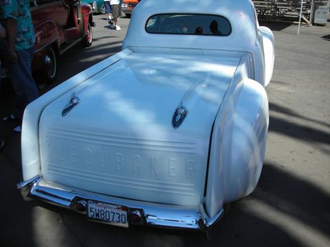1998 Ford Crown Victoria - Rear view of a white custom Studebaker pickup with a smooth tailgate, twin antennas, and a California plate reading 5W80730.