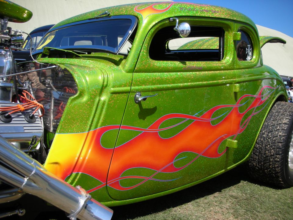 Green metalflake hot rod coupe with red and orange flames and chopped top
