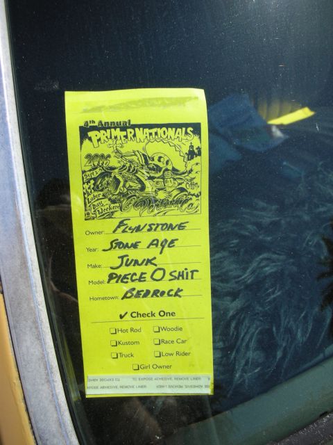 1998 Ford Crown Victoria - Primer Nationals car show registration entry card filled out and taped to a vehicle windshield.
