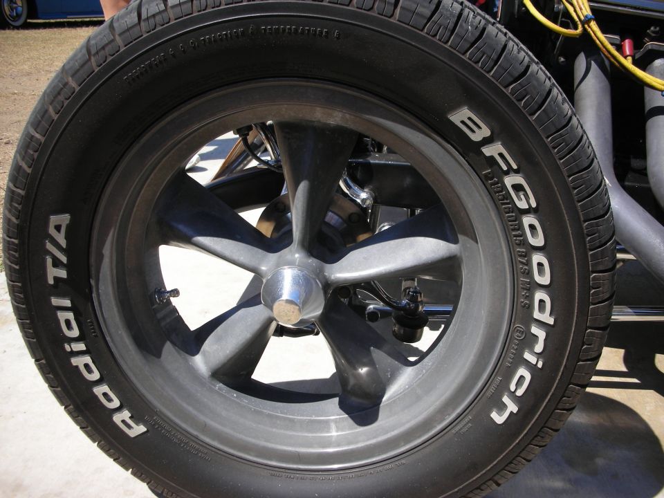 Detailed close-up of gray five-spoke mag wheel with BFGoodrich Radial T/A tire