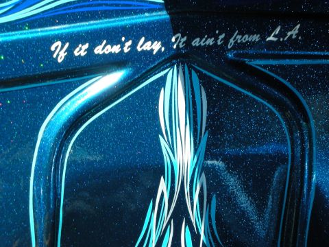 1998 Ford Crown Victoria - Blue metalflake car panel with white pinstriped flames and script reading If it don't lay, It ain't from L.A.