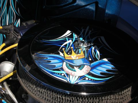1998 Ford Crown Victoria - round chrome air cleaner topped with airbrushed artwork of a crowned blue bird holding a baseball-textured eye.