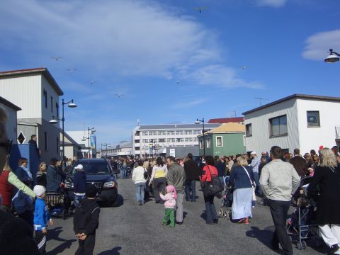1996 Ford Bronco - A black SUV is visible in a street scene with many pedestrians and buildings.