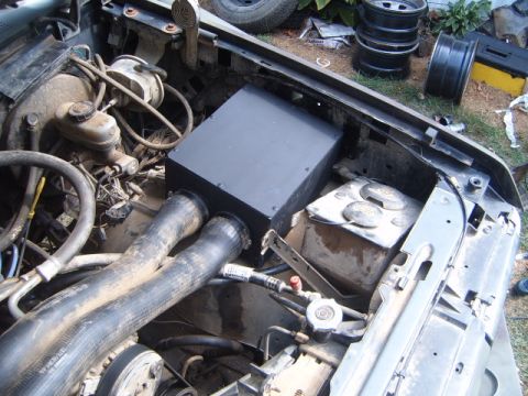 1988 Ford Bronco - The engine bay shows a custom snorkel installation with dual intake hoses and visible gauges.