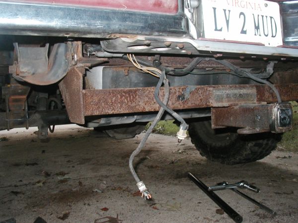 gas tank really exposed now.  I am going to redo the drawtite higher up and try and raise the gas tank the 3 inches to match the body lift.