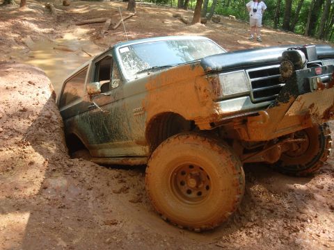 1995 Ford Bronco - This 1995 Ford Bronco is deep in the mud, stuck on an off-road trail.