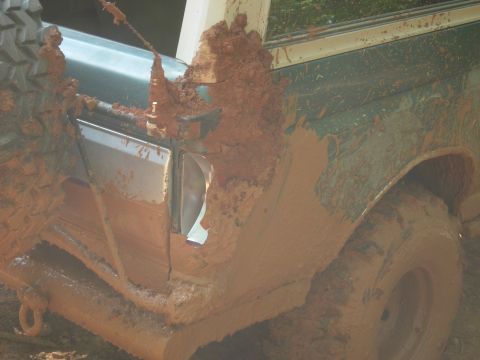 1995 Ford Bronco - This 1995 Ford Bronco is heavily covered in mud after off-roading.