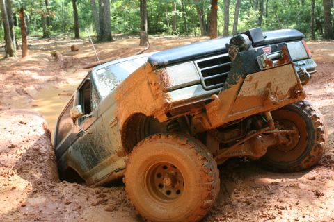 1990 Ford Bronco - This 1990 Ford Bronco is deep in a muddy ditch during an off-road excursion.