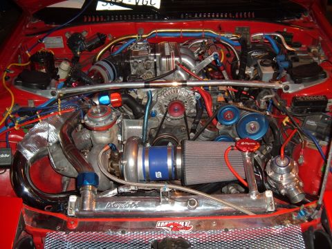 1991 Ford Probe - Customized engine bay a turbocharger, air filter, and various hoses and wires.