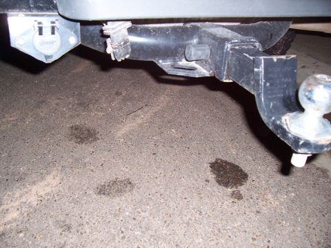 2003 Ford Ranger - Close-up of a trailer hitch assembly and its electrical connector, indicating towing capability.
