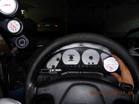 1993 Ford Probe - Interior view of a car's dashboard, showing multiple gauges and a steering wheel.