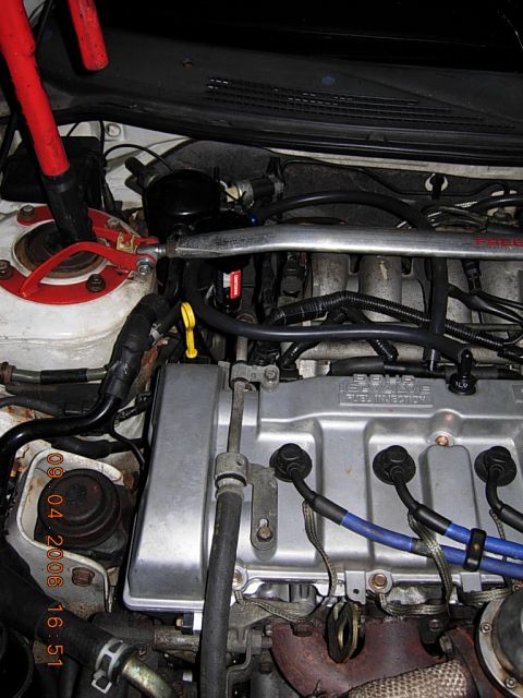 1993 Ford Probe - Close-up view of a car's engine bay, showing various components and wiring.