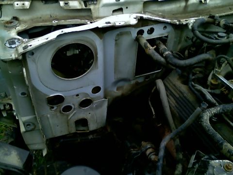 2002 Ford Crown Victoria - The firewall and engine bay are exposed, with various hoses and mechanical parts visible in the image.