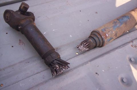1995 Ford Bronco - Damaged driveshaft components, likely from a vehicle experiencing significant mechanical failure.