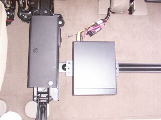 2001 Ford Excursion - DVD player installed under the 60 portion of the middle seat.
