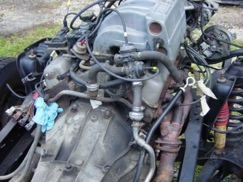 1991 Ford Bronco - Ford V8 engine and transmission assembly removed from a vehicle.