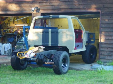 1991 Ford Bronco - A truck body is being worked on, with the chassis and rear wheels visible.