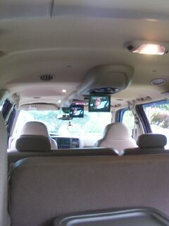 2001 Ford Excursion - I did say dual screen didn't I. The system is from Audiovox and the entire console mounts behind the factory console. Either display can on…
