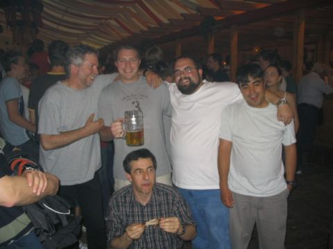 2003 Ford Focus - Several men are gathered together, with one holding a large beer mug.