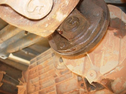 1995 Ford Bronco - Close-up view of a driveshaft u-joint and differential housing, showing 'BorgWarner' text.