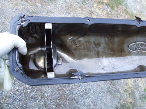 1979 Ford Bronco - Damaged Ford valve cover gasket removed for repair.
