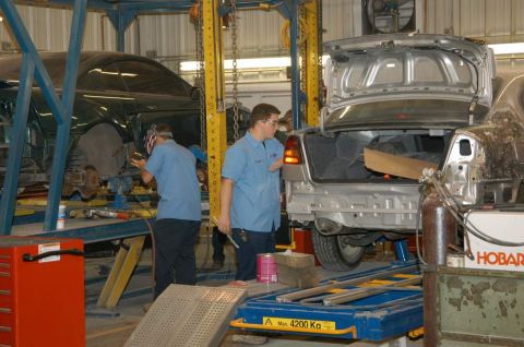 2006 Ford E350 - Jon working on a Subaru at LSTC.