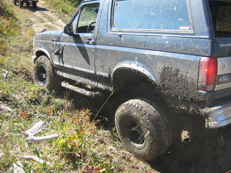 Mud-covered 1995 Ford Bronco 3q-front view, off-road