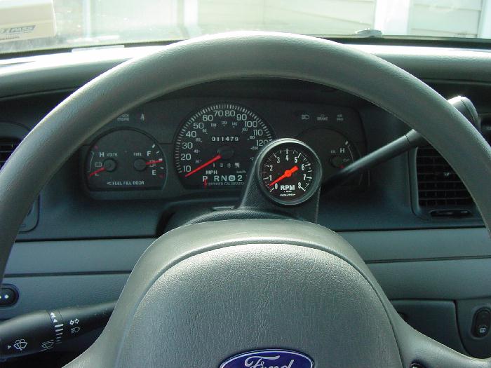 Ford instrument cluster and steering wheel with added center tachometer gauge