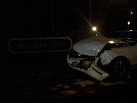 2001 Ford Crown Victoria - Car damaged in front of Makalapa Gate sign at night.