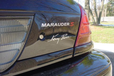 2003 Ford Crown Victoria - Marauder S badging and Kenny Brown signature on the rear of a black vehicle.