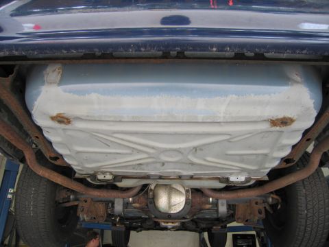 1991 Ford LTD Crown Victoria - Underside view of a blue vehicle, showing the fuel tank and exhaust components.