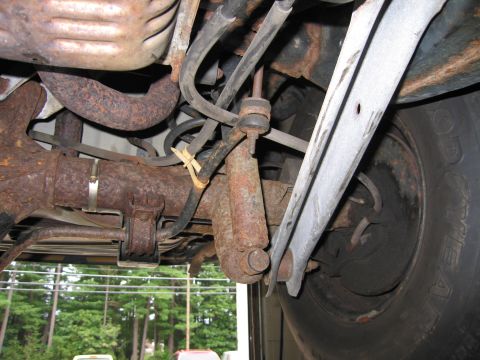 1991 Ford LTD Crown Victoria - Rusty rear suspension components are visible in this close-up view.