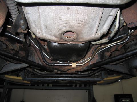 1991 Ford LTD Crown Victoria - Underside view of a 1991 Ford Crown Victoria LTD, focusing on the transmission and exhaust components.
